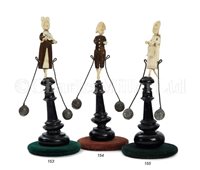Lot 153 - Ø  A CARVED IVORY AND WOOD DIEPPE BALANCE TOY,...