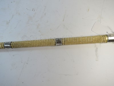 Lot 93 - Ø A RARE SILVER-MOUNTED MARINE IVORY CAGEWORK WALKING STICK, CIRCA 1898