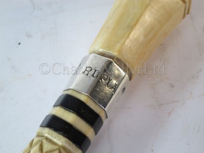 Lot 93 - Ø A RARE SILVER-MOUNTED MARINE IVORY CAGEWORK WALKING STICK, CIRCA 1898