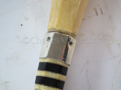 Lot 93 - Ø A RARE SILVER-MOUNTED MARINE IVORY CAGEWORK WALKING STICK, CIRCA 1898
