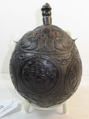 Lot 32 - A 19TH CENTURY CARVED COCONUT BUGBEAR