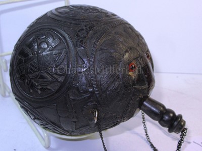 Lot 32 - A 19TH CENTURY CARVED COCONUT BUGBEAR