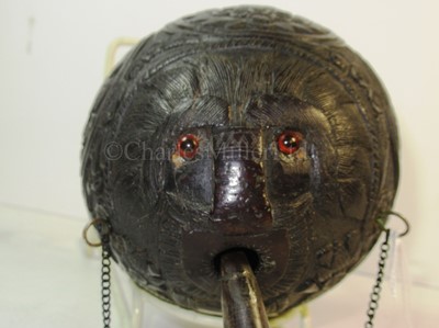 Lot 32 - A 19TH CENTURY CARVED COCONUT BUGBEAR