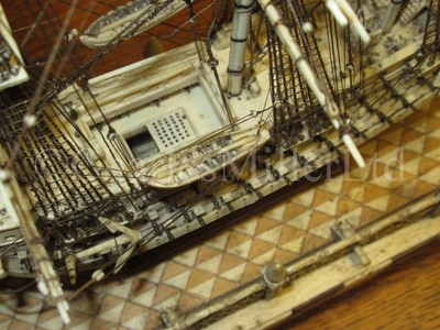 Lot 225 - AN ATTRACTIVE EARLY 19TH CENTURY FRENCH, NAPOLEONIC PRISONER OF WAR, BONE SHIP MODEL FOR A FIRST-RATE SHIP OF THE LINE